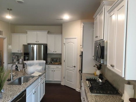 Superior Painting Pros & Wall Covering, Co. finishes cabinets in Mineral Springs